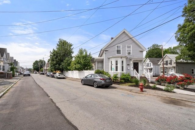 120 Fulton St, Lowell, MA 01850 - view of asphalt street featuring sidewalks, curbs, a residential view, and street lighting