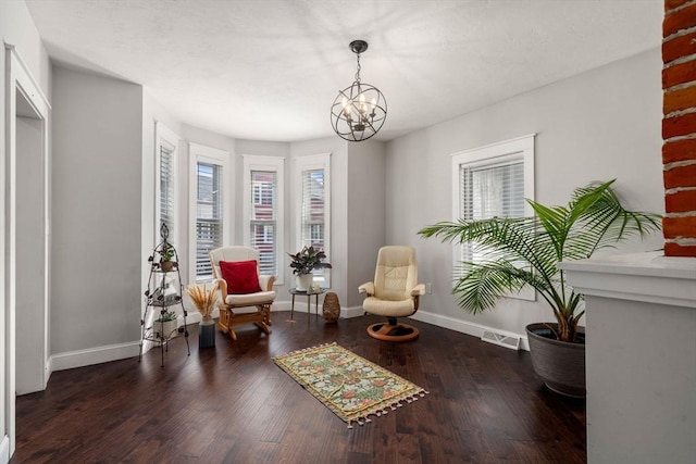 120 Fulton St, Lowell, MA 01850 - living area with a chandelier, baseboards, and wood finished floors