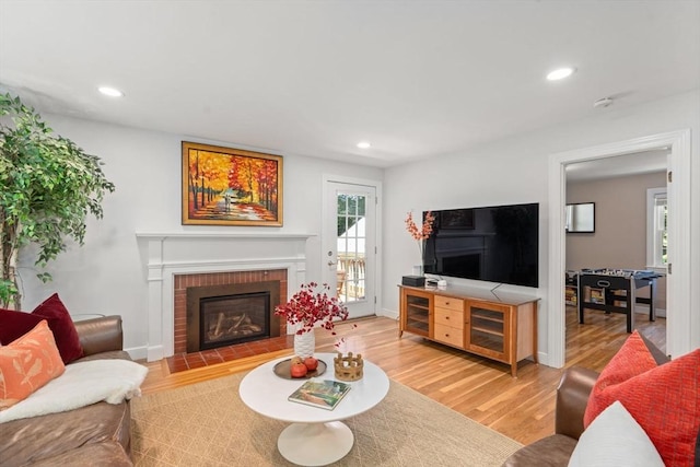 21 Studio Rd, Newton, MA 02466 - living room with light wood-style flooring, a fireplace, recessed lighting, and baseboards