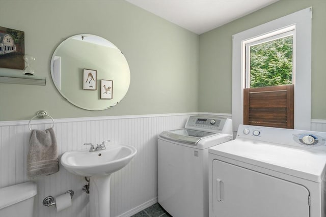 21 Studio Rd, Newton, MA 02466 - half bath featuring wainscoting, washer and clothes dryer, and toilet