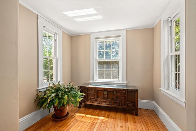 21 Studio Rd, Newton, MA 02466 - detailed view of wood finished floors, baseboards, and ornamental molding