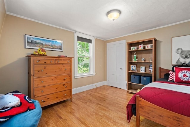 21 Studio Rd, Newton, MA 02466 - bedroom with light wood-style flooring, crown molding, and baseboards