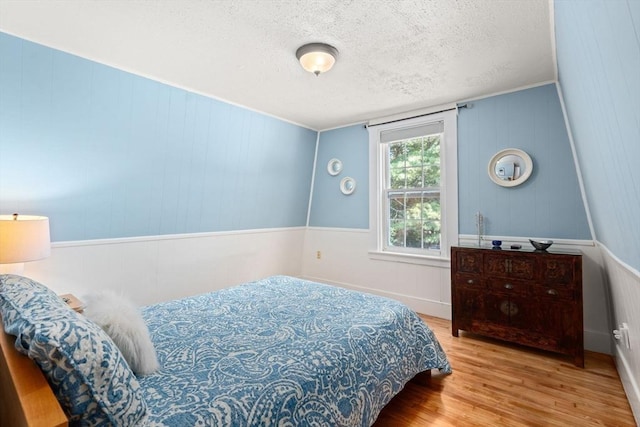 21 Studio Rd, Newton, MA 02466 - bedroom featuring wood finished floors and a textured ceiling