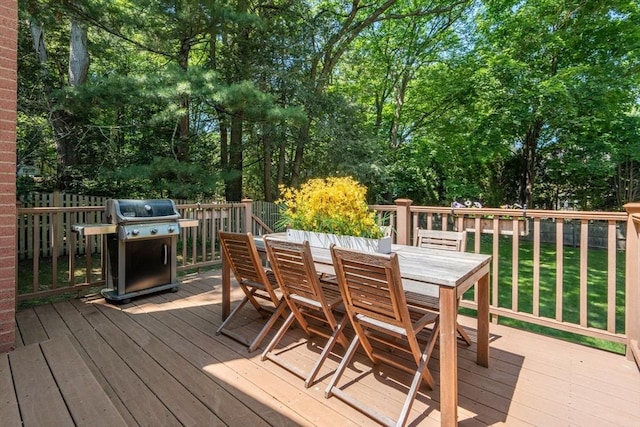 21 Studio Rd, Newton, MA 02466 - wooden deck with outdoor dining area, grilling area, and view of scattered trees