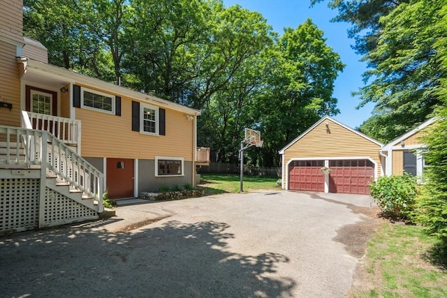 21 Studio Rd, Newton, MA 02466 - view of side of property with an outdoor structure and a garage