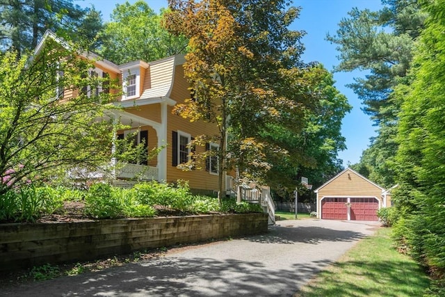 21 Studio Rd, Newton, MA 02466 - view of side of property featuring a garage and an outbuilding