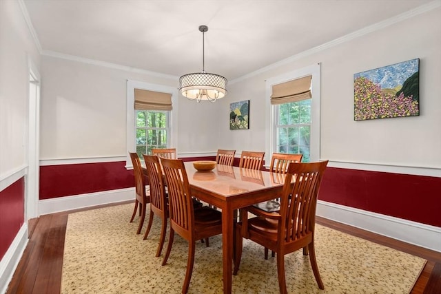 21 Studio Rd, Newton, MA 02466 - dining area featuring ornamental molding, plenty of natural light, wood finished floors, and baseboards