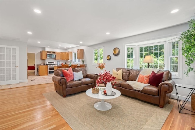 21 Studio Rd, Newton, MA 02466 - living area featuring light wood-type flooring, recessed lighting, and baseboards