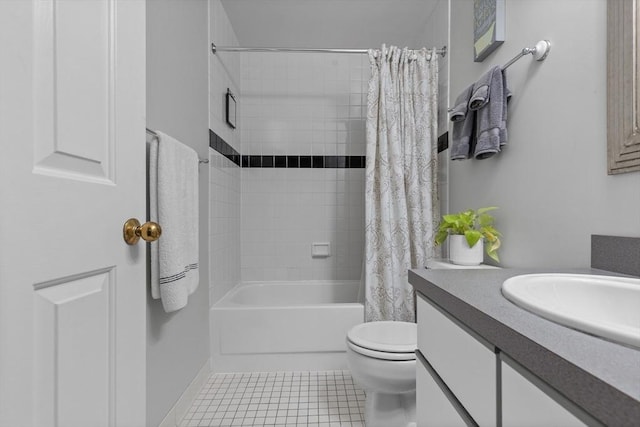 bathroom featuring shower / tub combo with curtain, tile patterned flooring, toilet, and vanity