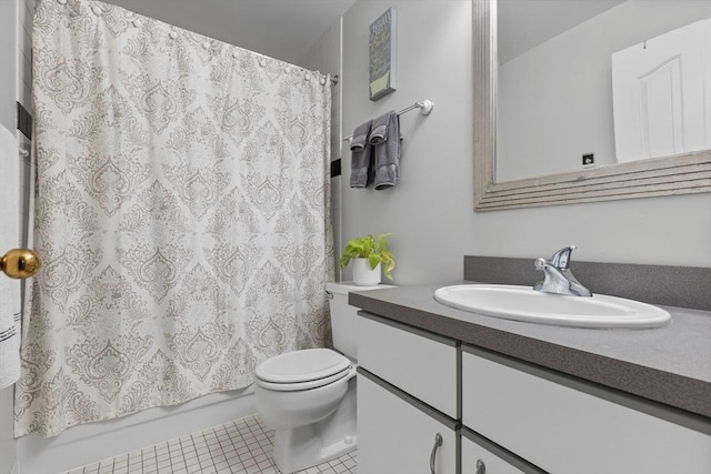 bathroom featuring toilet, tile patterned floors, vanity, and shower / bath combination with curtain