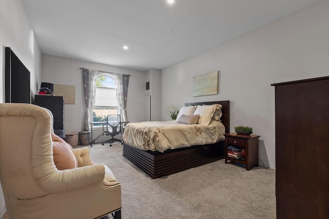 bedroom featuring light carpet and recessed lighting