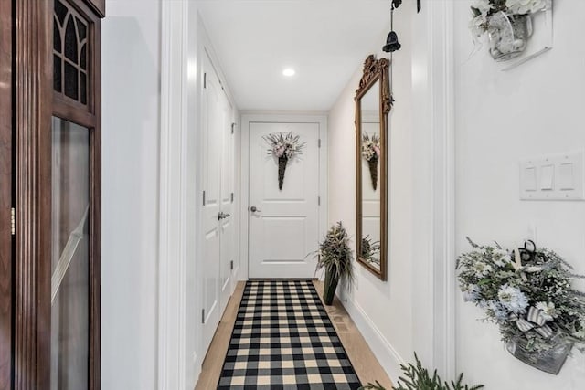 corridor with light wood-type flooring