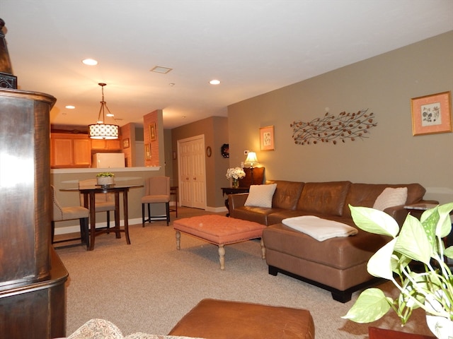 living room featuring light carpet