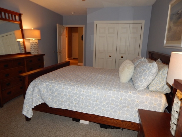 carpeted bedroom featuring a closet