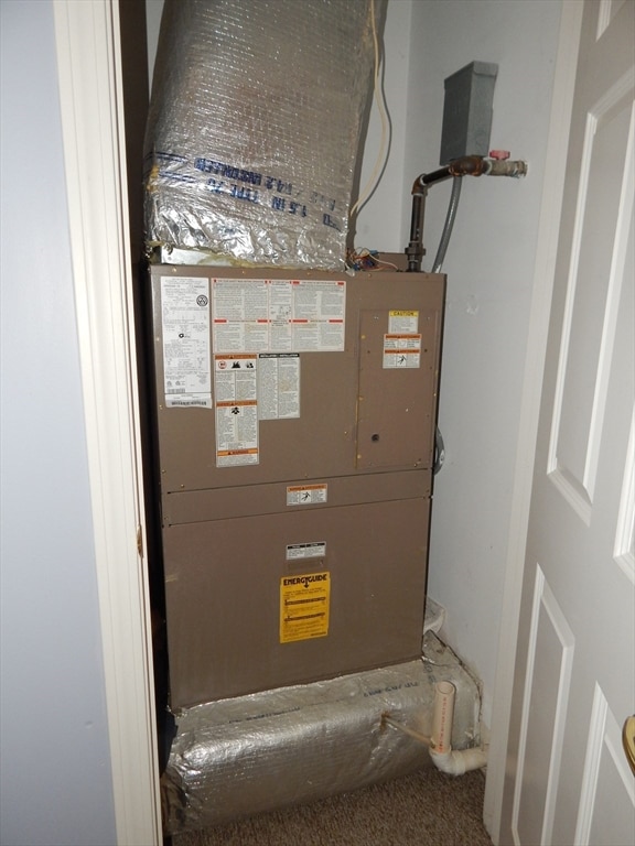 utility room with heating unit