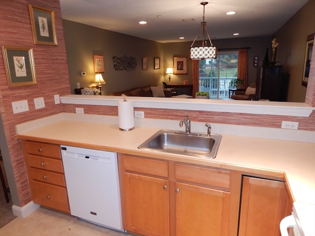 kitchen with sink, dishwasher, light tile patterned flooring, range, and hanging light fixtures