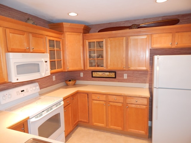 kitchen with white appliances and tasteful backsplash