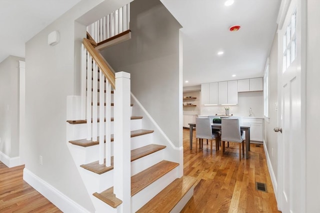 6 Ivy Cir, Winchester, MA 01890 - staircase featuring wood finished floors and recessed lighting