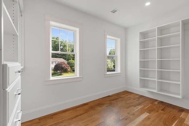 6 Ivy Cir, Winchester, MA 01890 - spare room featuring wood finished floors, built in features, and recessed lighting