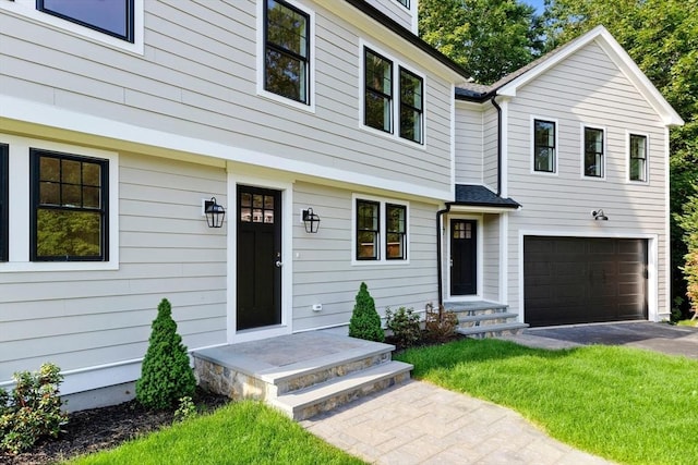 6 Ivy Cir, Winchester, MA 01890 - view of front of house with an attached garage and driveway