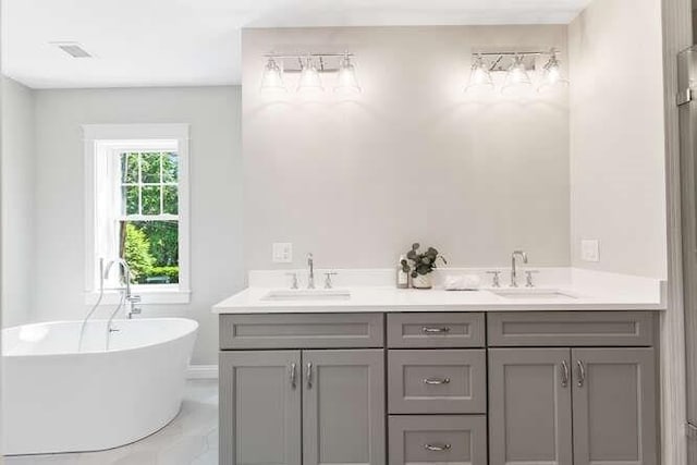 6 Ivy Cir, Winchester, MA 01890 - bathroom with a freestanding tub and double vanity