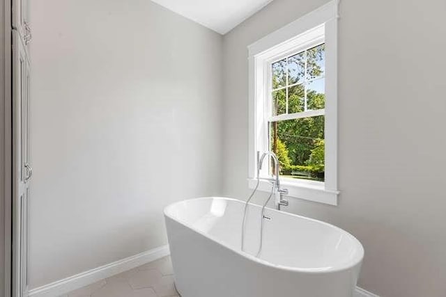 6 Ivy Cir, Winchester, MA 01890 - bathroom featuring baseboards and a freestanding tub
