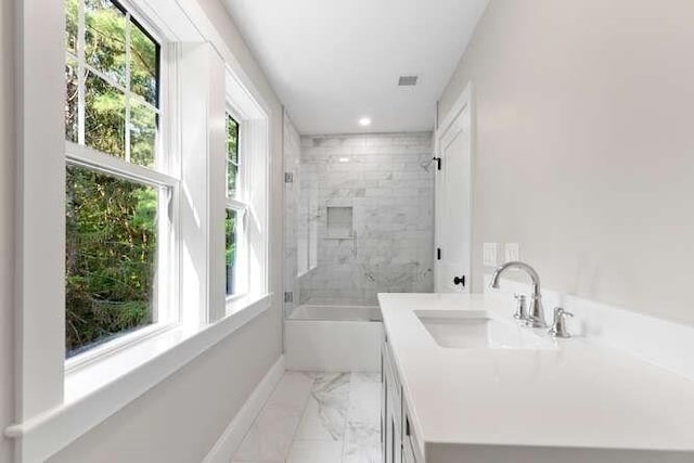 6 Ivy Cir, Winchester, MA 01890 - bathroom with marble look tiles, healthy amount of natural light, shower / bath combination, vanity, and recessed lighting