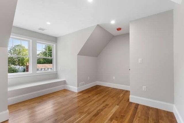 6 Ivy Cir, Winchester, MA 01890 - additional living space with wood finished floors, recessed lighting, and vaulted ceiling