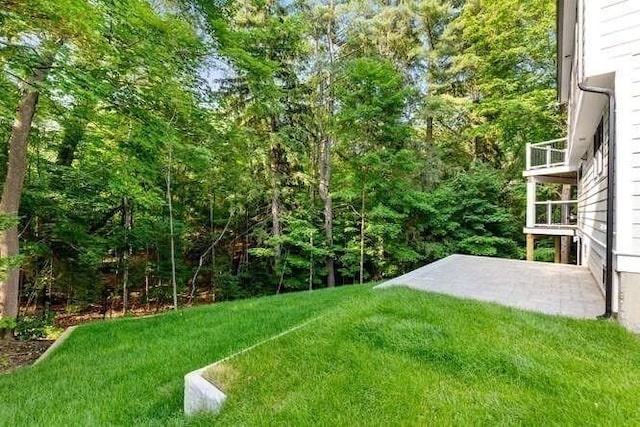 6 Ivy Cir, Winchester, MA 01890 - view of green lawn with a patio and a wooded view