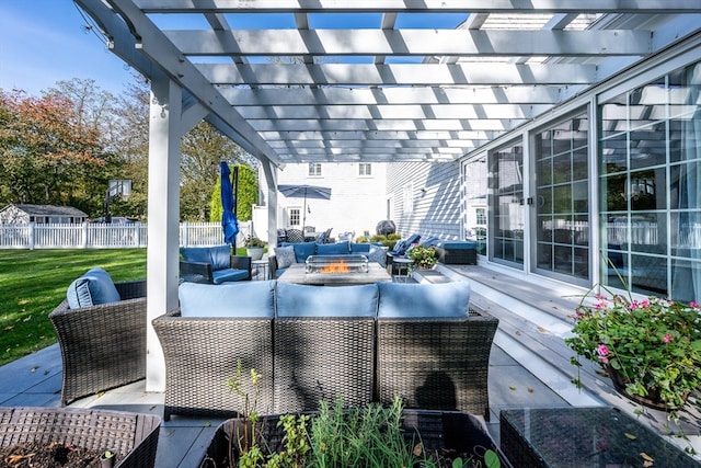 view of patio / terrace with an outdoor living space with a fire pit and a pergola