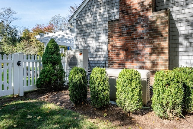 view of side of property featuring central AC unit