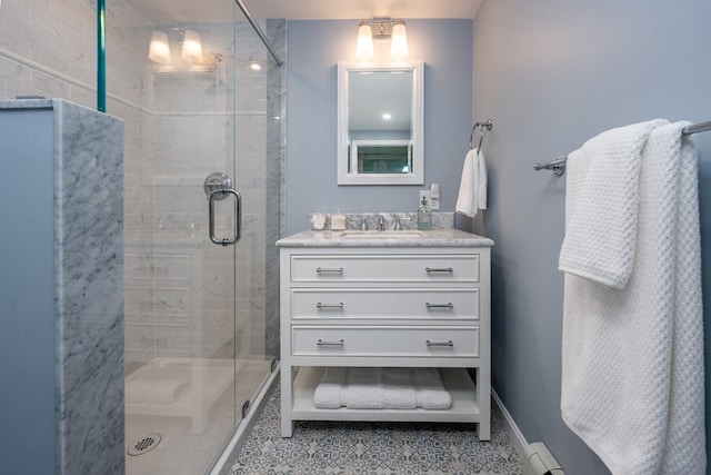 bathroom featuring vanity and an enclosed shower