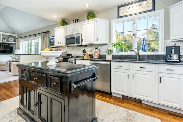 kitchen featuring white cabinetry, light hardwood / wood-style floors, stainless steel appliances, and sink