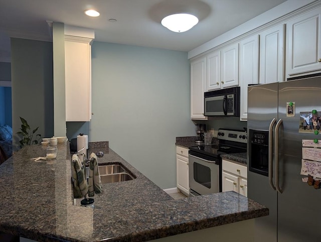 190 Chickering Rd Unit 313D, North Andover, MA 01845 - kitchen featuring stainless steel appliances, a peninsula, a sink, and white cabinetry