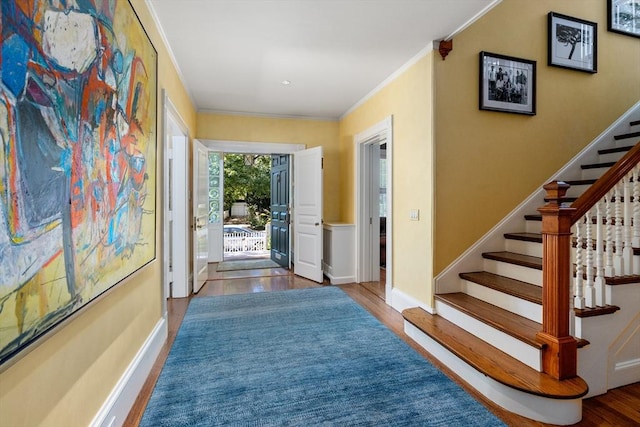 hall featuring crown molding and hardwood / wood-style flooring