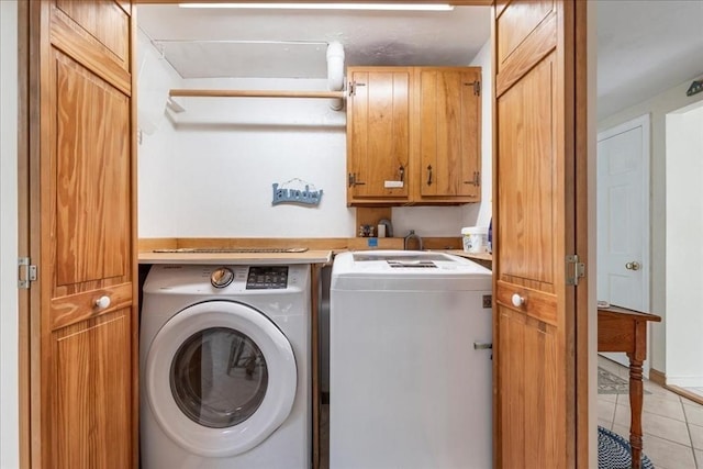 49 Karen Rd, Hanover, MA 02339 - laundry room featuring separate washer and dryer, cabinet space, and light tile patterned flooring