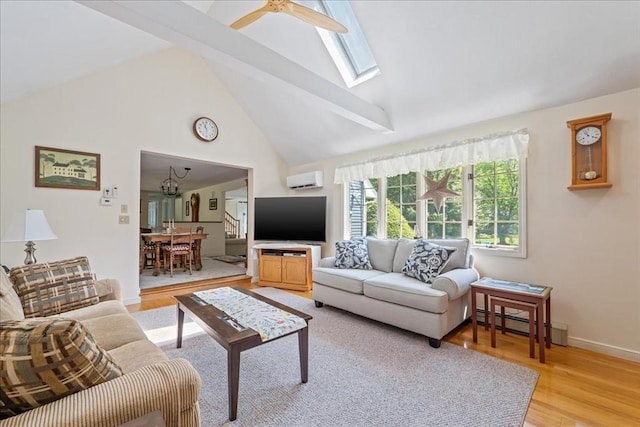 49 Karen Rd, Hanover, MA 02339 - living area featuring baseboard heating, light wood finished floors, a skylight, a wall unit AC, and high vaulted ceiling