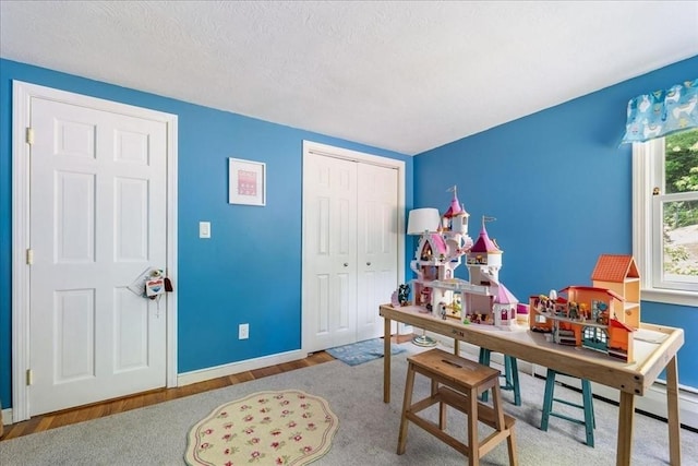 49 Karen Rd, Hanover, MA 02339 - home office with baseboards, wood finished floors, and a textured ceiling