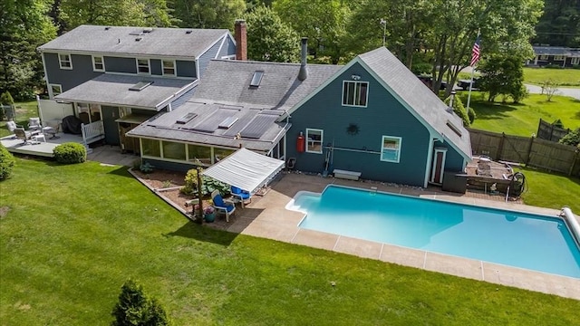 49 Karen Rd, Hanover, MA 02339 - back of property with a deck, a patio area, a chimney, a shingled roof, and view of wooded area