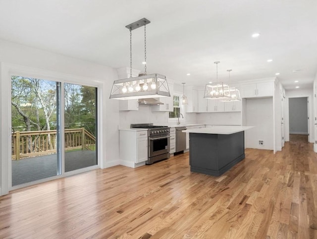 316 Old Westport Rd, Dartmouth, MA 02747 - kitchen featuring appliances with stainless steel finishes, light countertops, white cabinets, light wood-style flooring, and recessed lighting