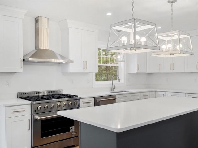 316 Old Westport Rd, Dartmouth, MA 02747 - kitchen with wall chimney range hood, stainless steel appliances, a sink, light countertops, and a chandelier