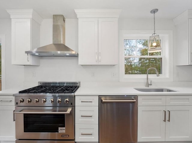 316 Old Westport Rd, Dartmouth, MA 02747 - kitchen featuring stainless steel appliances, wall chimney range hood, a sink, and white cabinetry