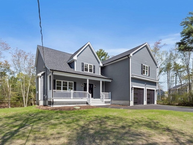 316 Old Westport Rd, Dartmouth, MA 02747 - traditional home with covered porch, a garage, asphalt driveway, and a front yard