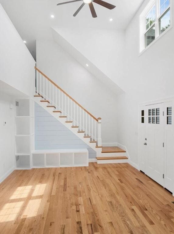 316 Old Westport Rd, Dartmouth, MA 02747 - foyer with stairs, ceiling fan, wood finished floors, a towering ceiling, and baseboards