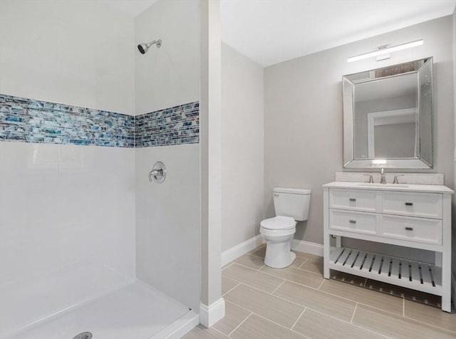 316 Old Westport Rd, Dartmouth, MA 02747 - full bathroom with toilet, tiled shower, vanity, and baseboards