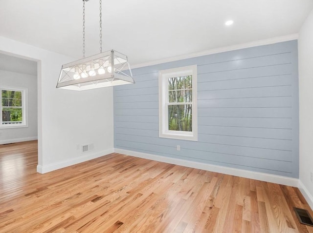 316 Old Westport Rd, Dartmouth, MA 02747 - unfurnished dining area featuring plenty of natural light, baseboards, light wood-style flooring, and crown molding