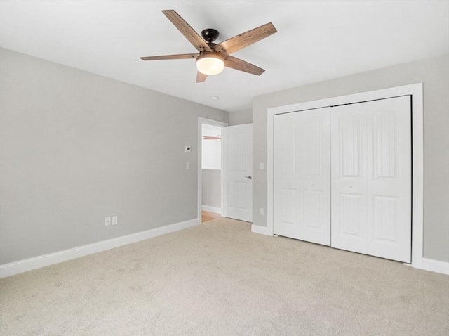 316 Old Westport Rd, Dartmouth, MA 02747 - unfurnished bedroom with light colored carpet, baseboards, a closet, and a ceiling fan