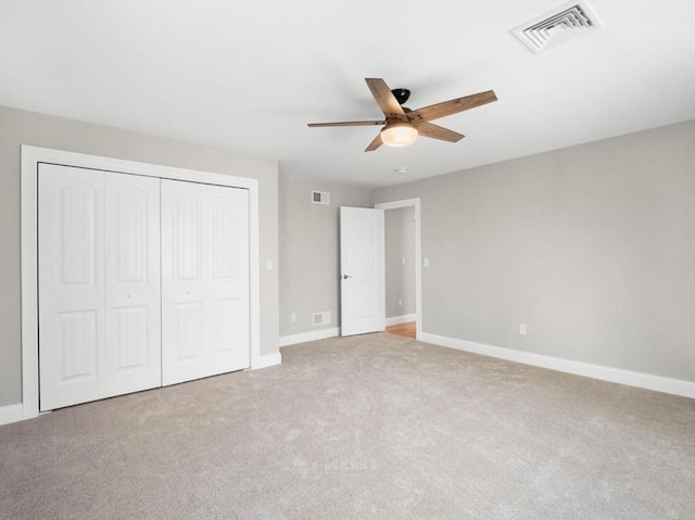 316 Old Westport Rd, Dartmouth, MA 02747 - unfurnished bedroom featuring a closet, carpet, baseboards, and ceiling fan