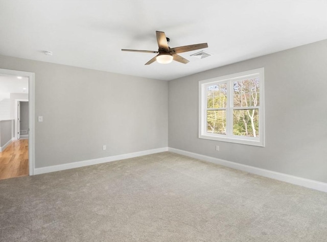 316 Old Westport Rd, Dartmouth, MA 02747 - spare room featuring a ceiling fan, light carpet, baseboards, and a smoke detector