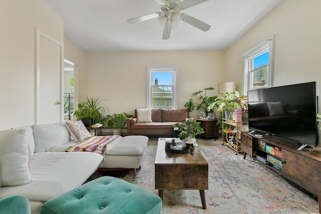 living room featuring a ceiling fan
